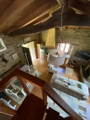 an overhead view of a living room with a stone wall at O Paxar in Samos
