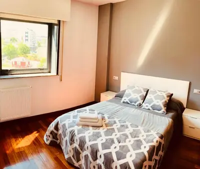 a bedroom with a bed and a window at lucushouse II in Lugo