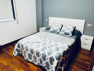 a bedroom with a bed with two towels on it at lucushouse II in Lugo