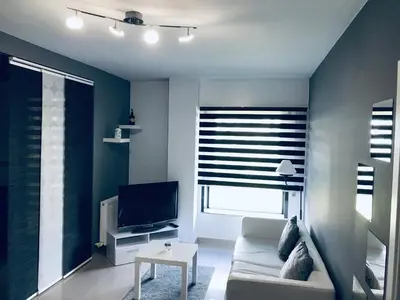a living room with a couch and a tv at lucushouse II in Lugo