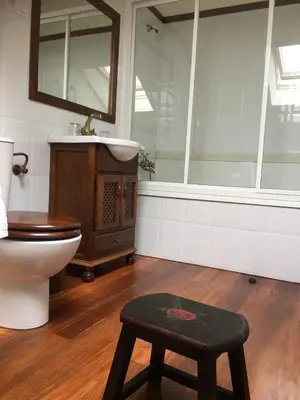 a bedroom with a bed with a canopy at Villa Auristela in Navia