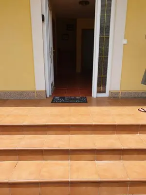an empty room with a wooden floor and a door at Casa César in Barreiros