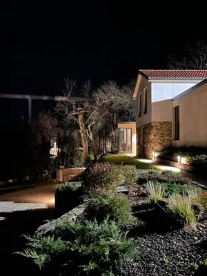 a house at night with lights in the yard at Eira Gundián in Vedra