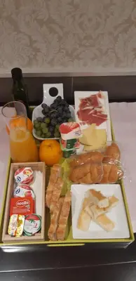 a tray filled with different types of food on a table at Hostal-Restaurante LUGANO in Verín