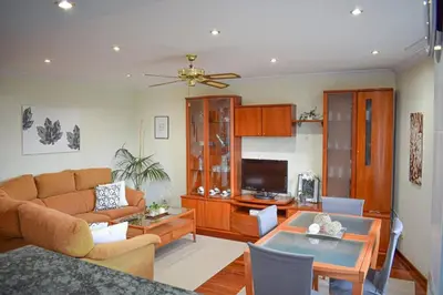 a living room with a couch and a table at Lucus Dúplex in Lugo