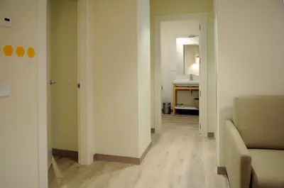 a living room with a couch and a table at APARTAMENTOS TURÍSTICOS GUIANA in Ponferrada
