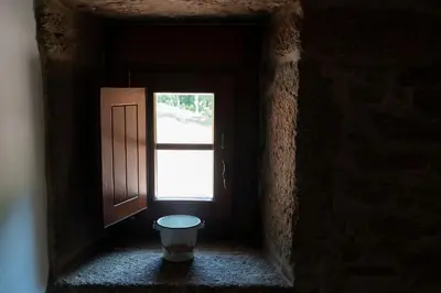 a hallway with a door and a window at Casa rural completa Río Sarela in Santiago de Compostela