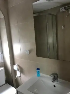 a bathroom with a sink and a mirror at Polvorín in Ourense