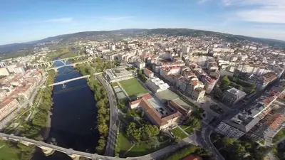 an aerial view of a city with a river at Polvorín in Ourense