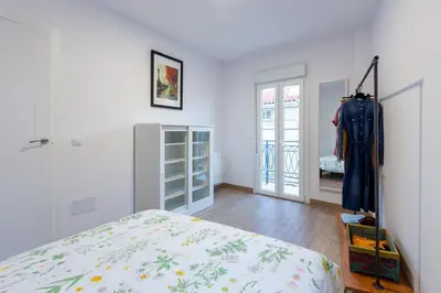 a bedroom with a bed and a room with a closet at Apartamentos Moreira & Betanzos in Betanzos