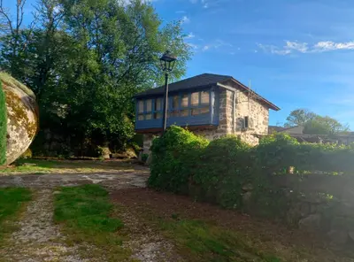 a house with a fence in front of it at Vila Morena in Corzos