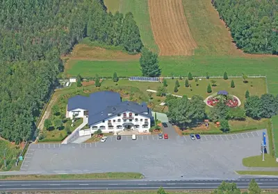 an aerial view of a large house with a large parking lot at Hostal Restaurante O'Cadaval in Frades