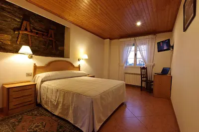 a bedroom with a large bed in a room at Casa Cazoleiro in Meira