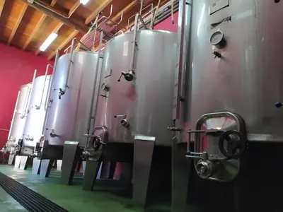 a row of silver tanks lined up in a room at CASA MENCIA in Sober