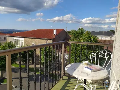 a balcony with a table and a cup of coffee at CASA MENCIA in Sober