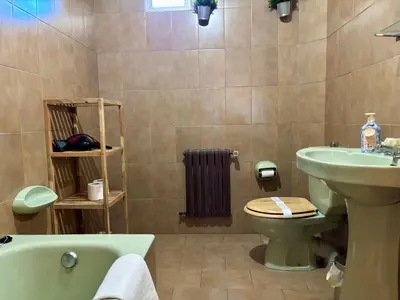 a bathroom with a sink and a toilet and a tub at CASA MENCIA in Sober