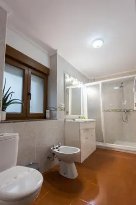 a bathroom with a toilet and a sink and a tub at CASA SEGADE in A Coruña