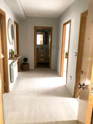 an empty hallway with a door leading into a room at Apartamento Adelina in Silleda