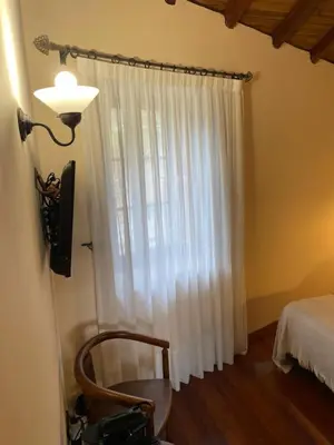 a bathroom with a sink and a toilet and a mirror at Casa de Costoia in Santiago de Compostela