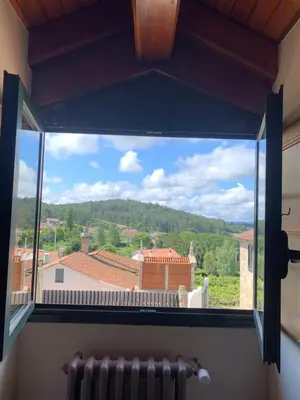 a room with a large window and two speakers at Casa de Costoia in Santiago de Compostela