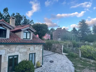 a bathroom with a toilet and a shower in it at Casa de Costoia in Santiago de Compostela