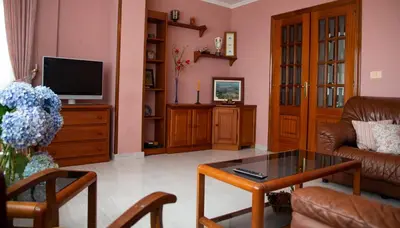 a living room with a couch and a coffee table at Pico da Costa in Barreiros