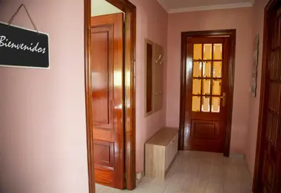 a hallway with a door and a sign on the wall at Pico da Costa in Barreiros