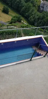 an overhead view of a swimming pool with a net at Hotel Alina in Cangas del Narcea