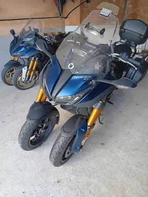 a blue motorcycle parked on the ground at Hotel Alina in Cangas del Narcea