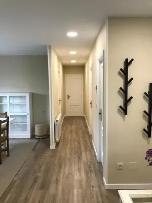 a hallway of a home with wooden floors and white walls at Casa Otilia - Rural - Camino de Santiago - Arzúa in Arzúa
