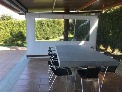 a black table and chairs on a patio at Casa Hipólito in A Estrada
