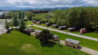 an aerial view of a farm with houses and trees at La Villa del Karting in El Teso