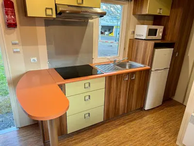 a small kitchen with a sink and a counter at La Villa del Karting in El Teso