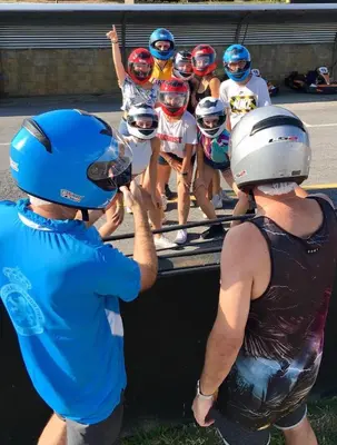 a group of people wearing helmets on a truck at La Villa del Karting in El Teso