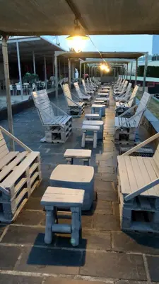a row of lounges and chairs on a boat at La Villa del Karting in El Teso