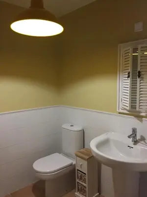 a bathroom with a toilet and a sink at Precioso adosado a 5 minutos de la playa de Miño in Miño