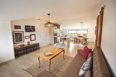 a living room with a couch and a table at Ático con maravillosas vistas in Viveiro