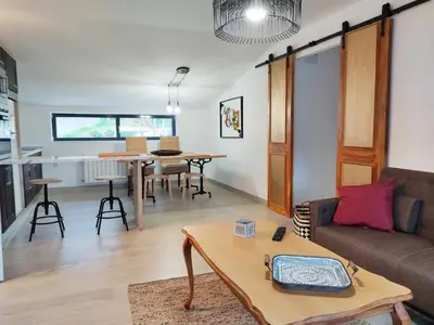 a living room with a couch and a table at Ático con maravillosas vistas in Viveiro