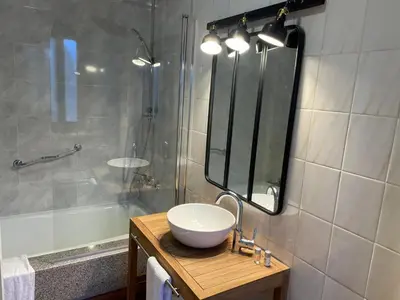 a bathroom with a sink and a shower at Hotel San Marcus in Porta