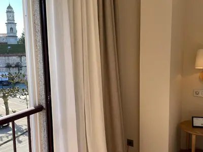 a window in a hotel room with a curtain at Hotel San Marcus in Porta