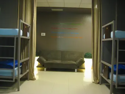 a living room with a couch and two bunk beds at albergue SANTO SANTIAGO in Santiago de Compostela