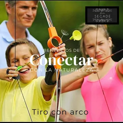 a woman and a young boy playing with a bow and arrow at Finca Segade in A Estrada