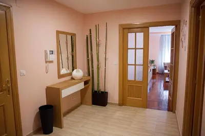 a room with a hallway with a mirror and a door at Laros Pios Alojamiento 2 in Villalba