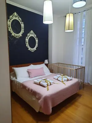 a bedroom with a bed with two towels on it at BERAMAR APARTMENT in Viveiro