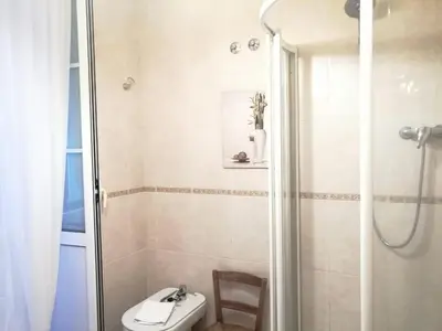 a bathroom with a shower and a sink and a toilet at BERAMAR APARTMENT in Viveiro
