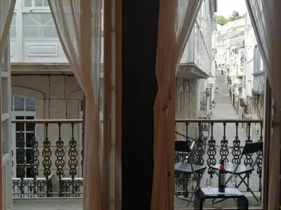 an open balcony with a view of a street at BERAMAR APARTMENT in Viveiro