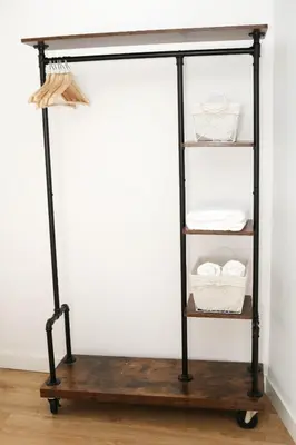 a black iron and wood stand with three shelves at Tu Rincón en Compostela in Santiago de Compostela