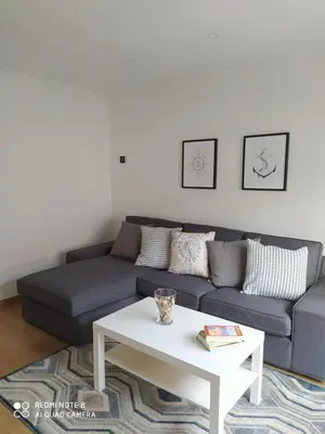 a living room with a couch and a coffee table at Piso de alquiler en Tapia de Casariego in Tapia de Casariego