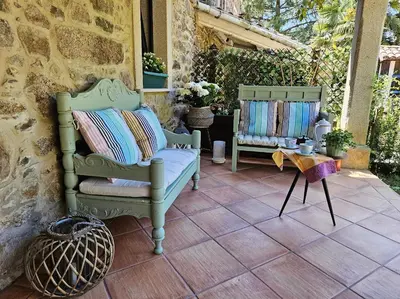 two chairs and a table on a patio at A Casa dos Avós - Vilariño - A Coruña in Vilariño