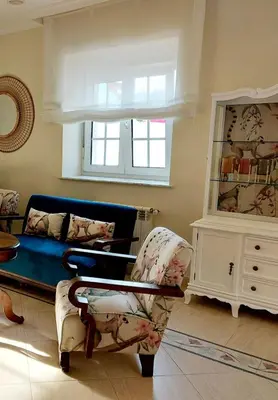 a living room with a couch and a chair at Casa Sueño in Foz